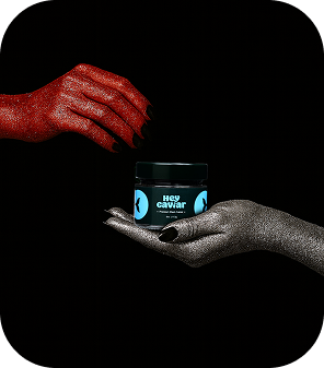 Luxury snacks meant to be eaten now – Hey Caviar black caviar jar being passed between hands