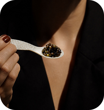 Woman tasting caviar for the Buying Caviar Online Should Feel Easi er guide