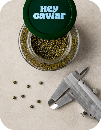 Premium caviar price markup illustrated with a Hey Caviar tin in “The Part of the Price That Isn’t About the Caviar”